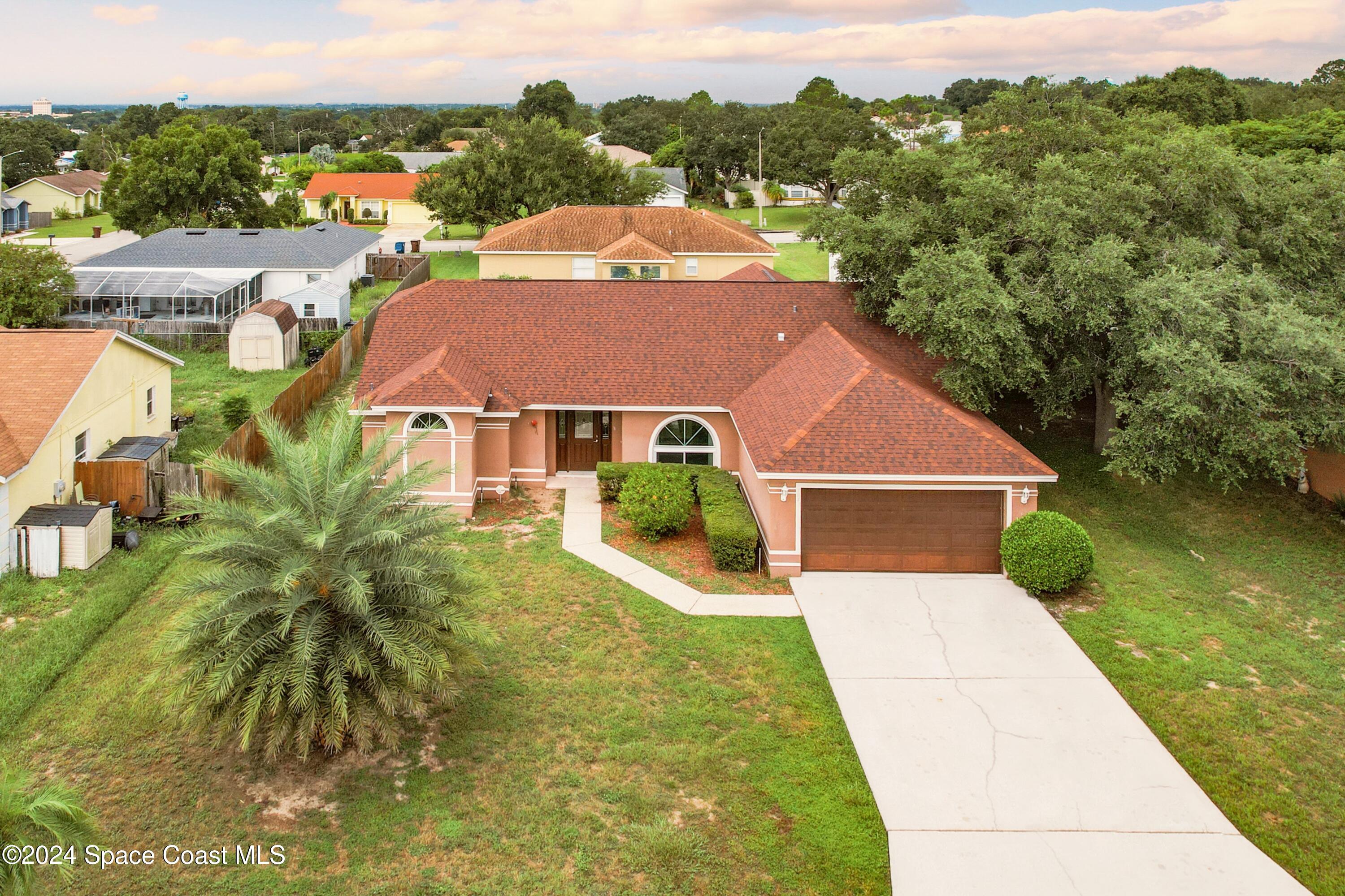 a aerial view of a house with a garden