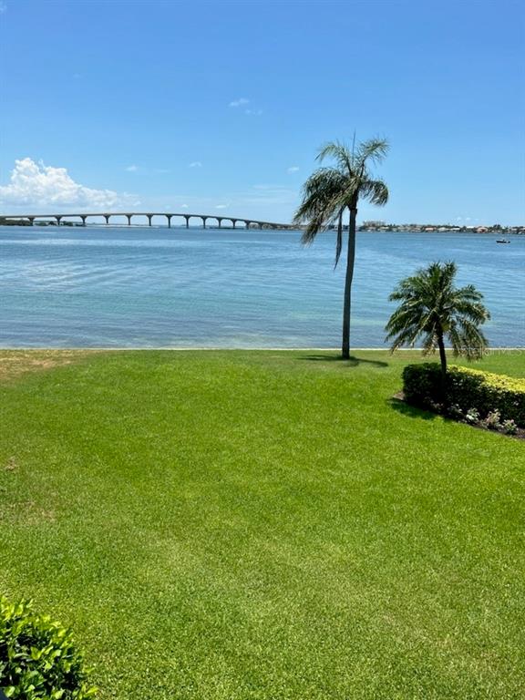 a view of a lake with a big yard