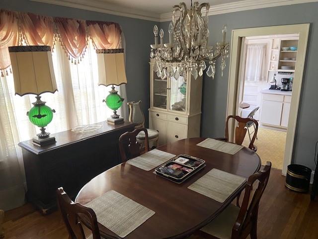 a view of a dining room with furniture and window