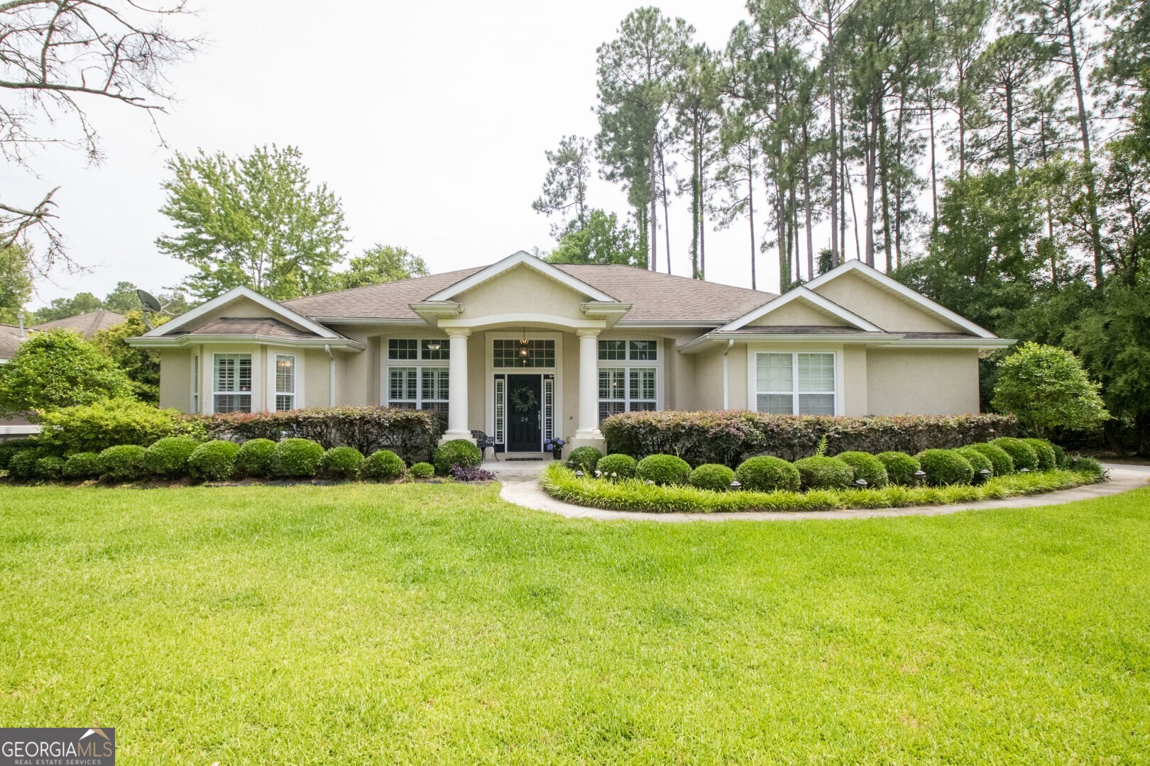 a front view of a house with a yard