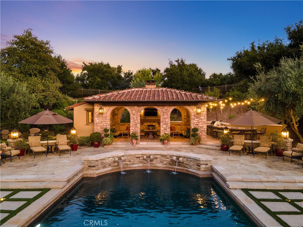 a view of outdoor space with swimming pool and patio