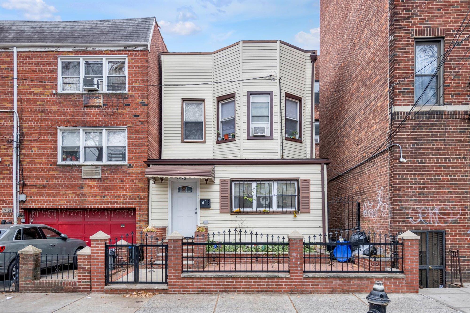 View of property featuring a garage