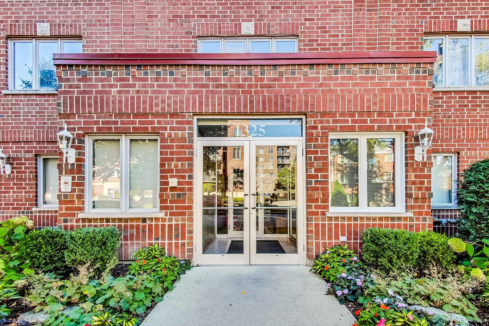 front view of a brick house many windows