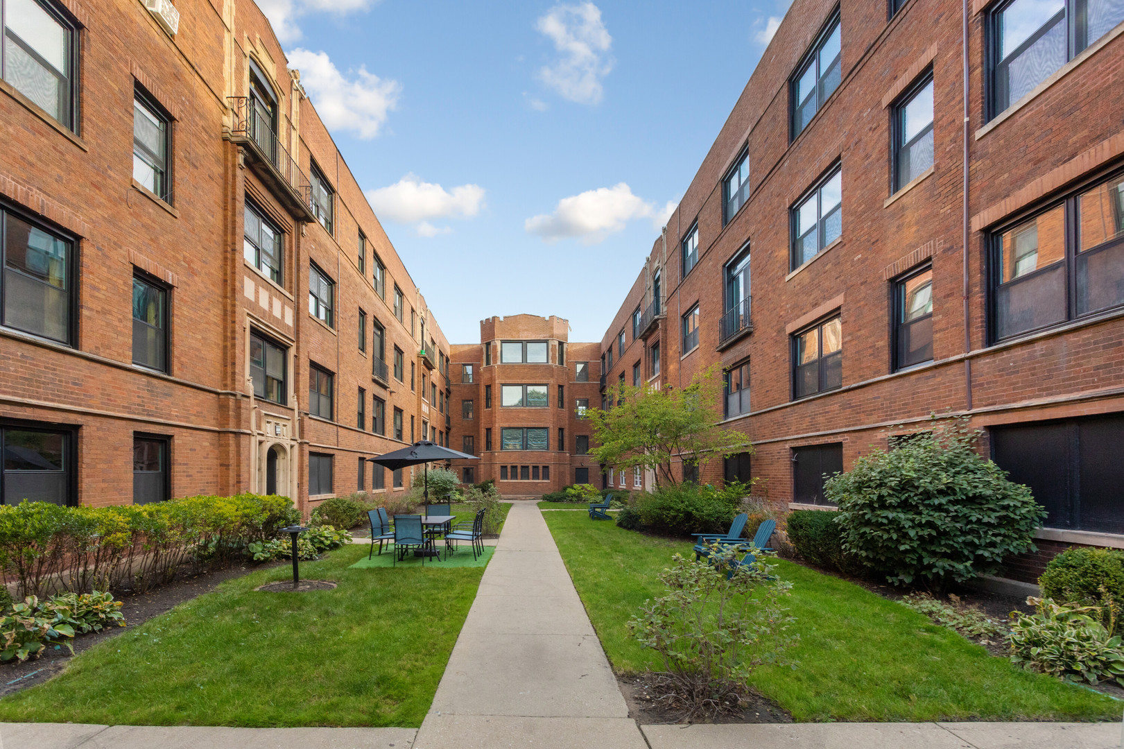 a view of a building with a yard