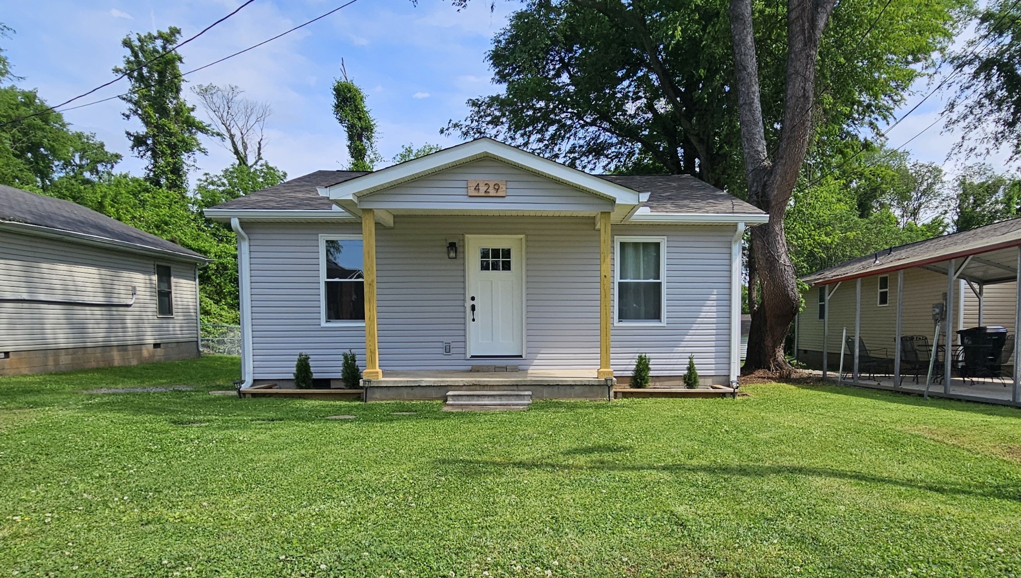 a front view of house with a yard