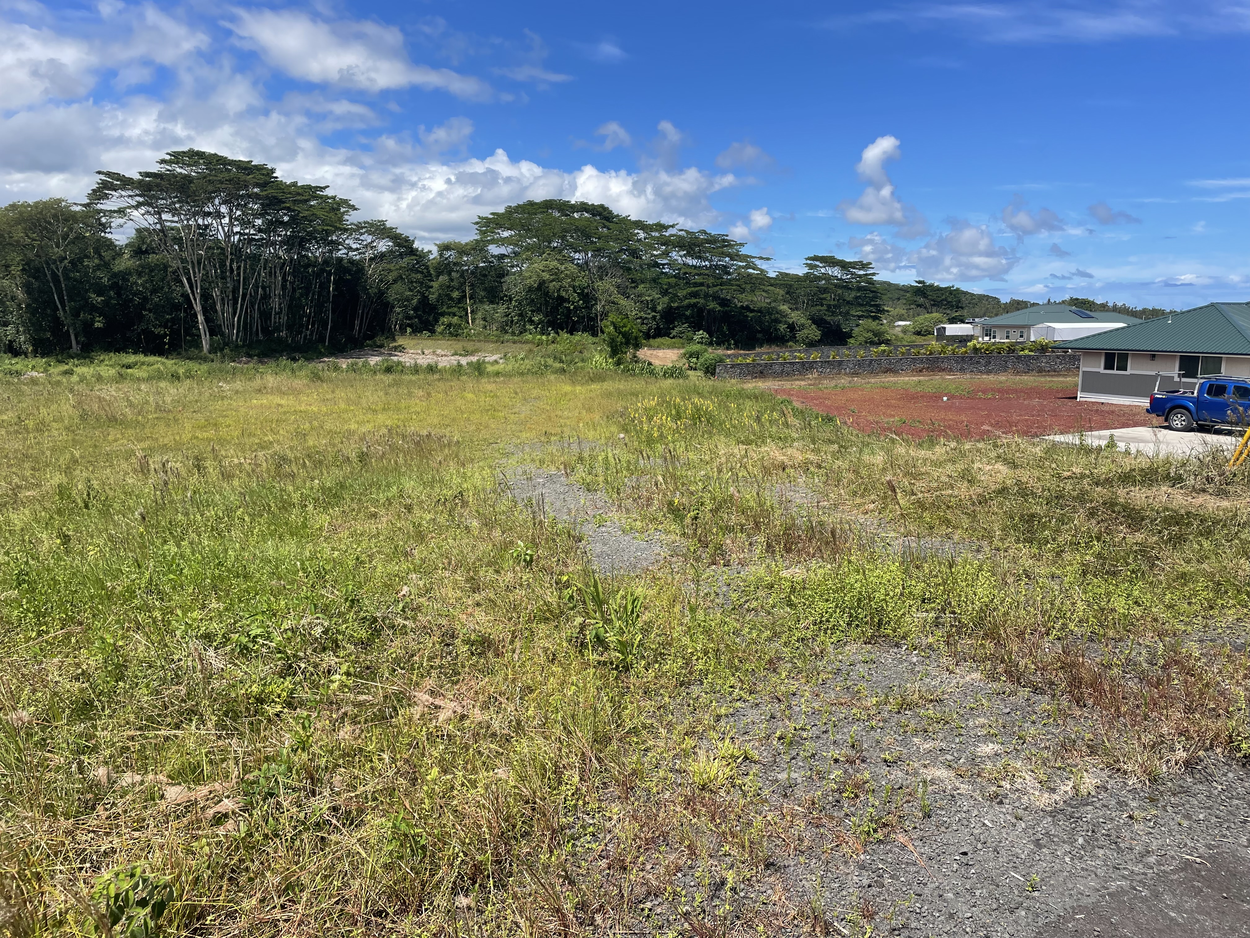 a view of a lake with houses in the back