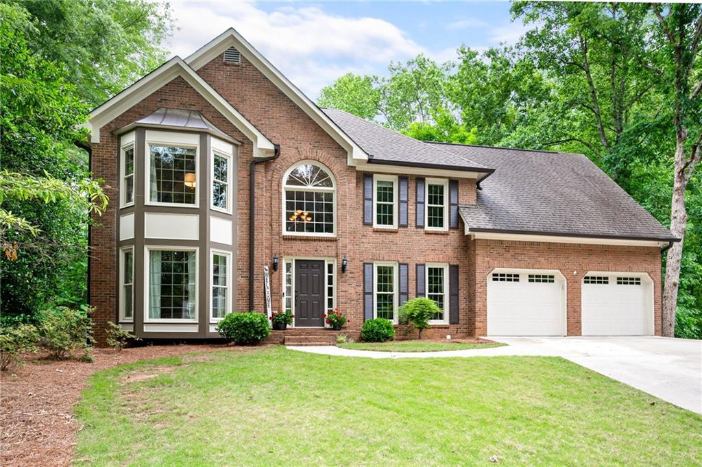 front view of a house with a yard