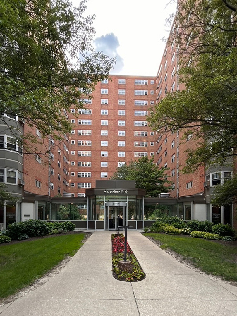 a view of a building with a yard