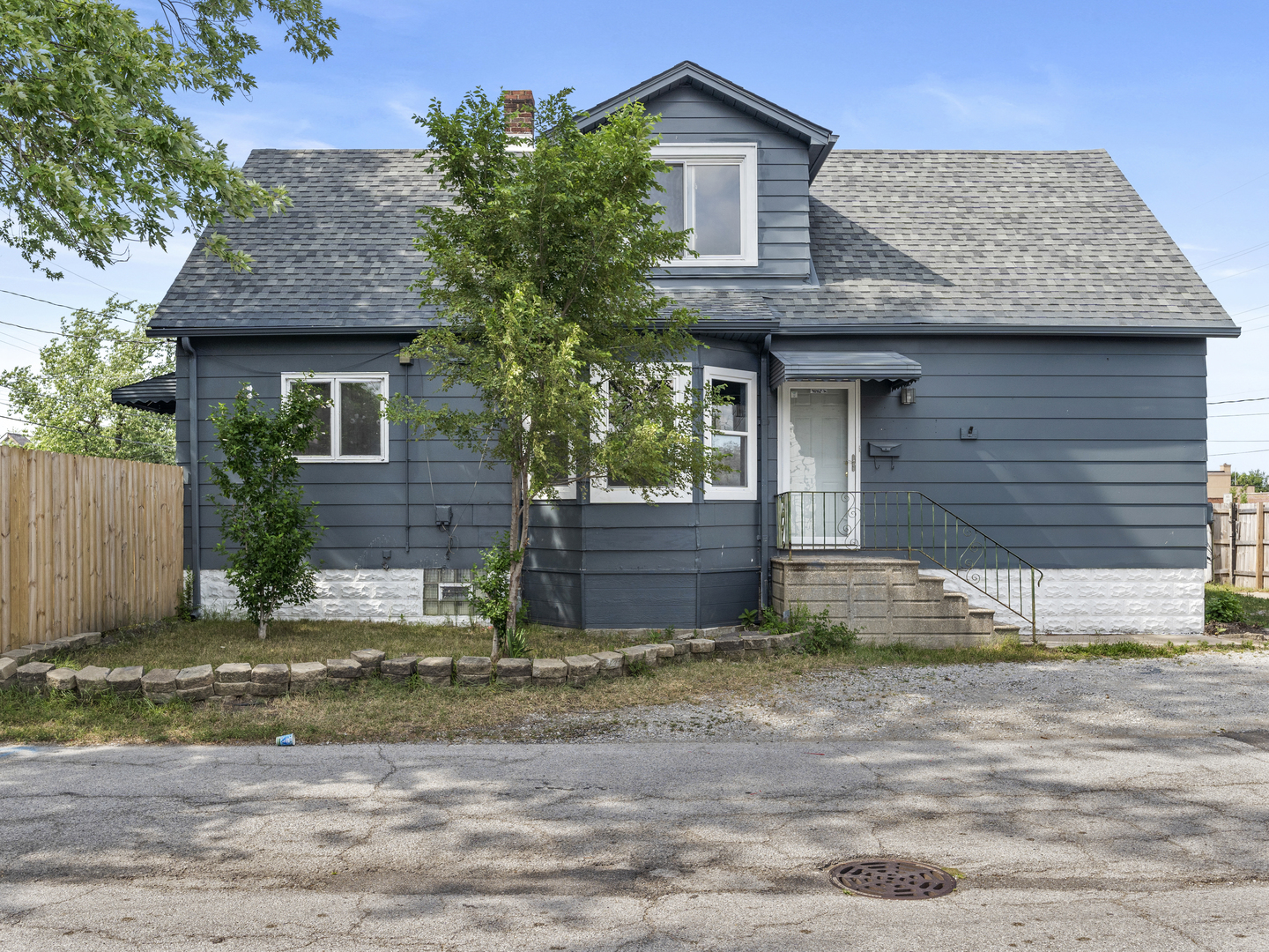 a view of a house with a yard and plants