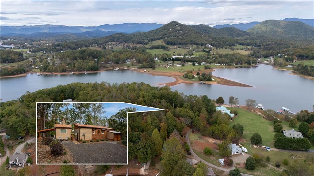 an aerial view of residential house with outdoor space and lake view