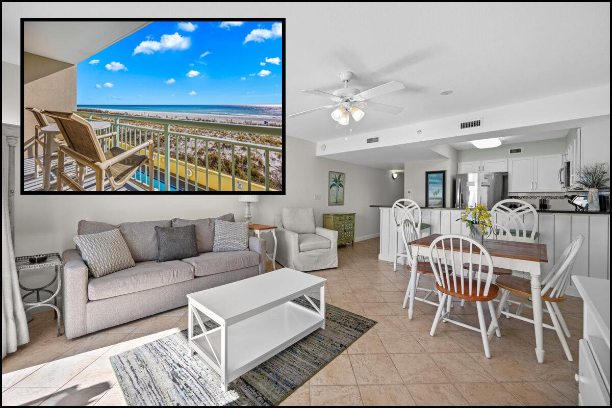 a living room with furniture and kitchen view