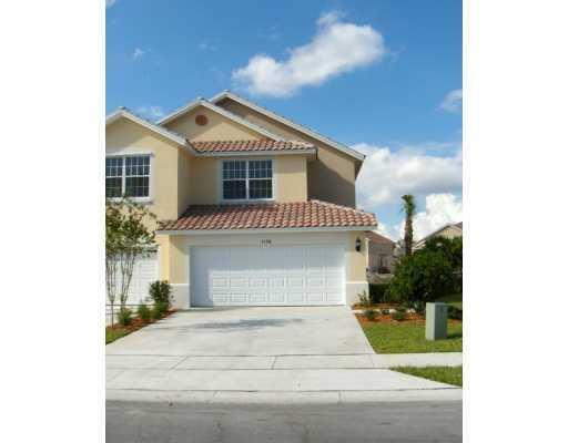 a front view of a house with a garage