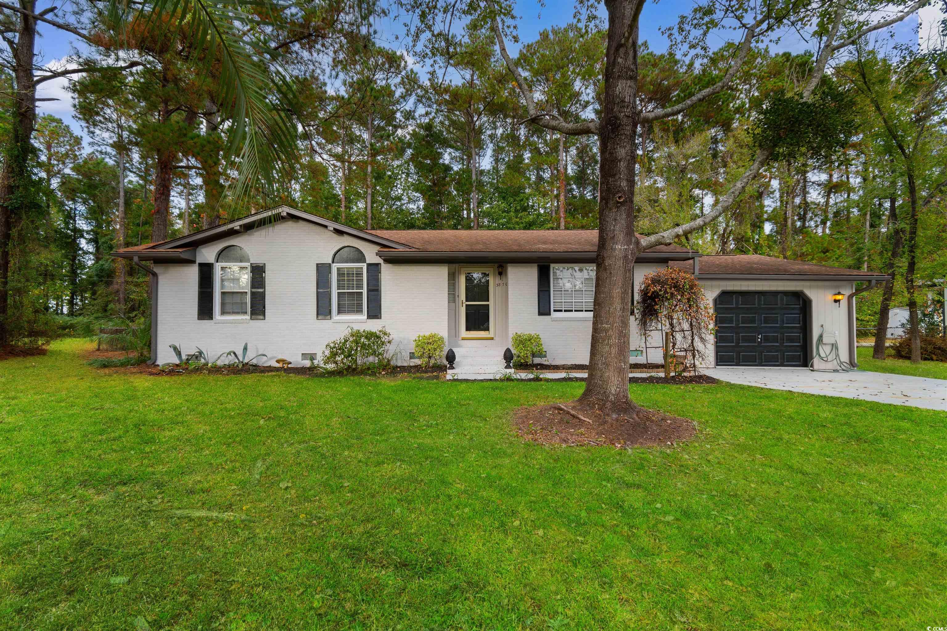 View of front of home featuring a garage and a fro