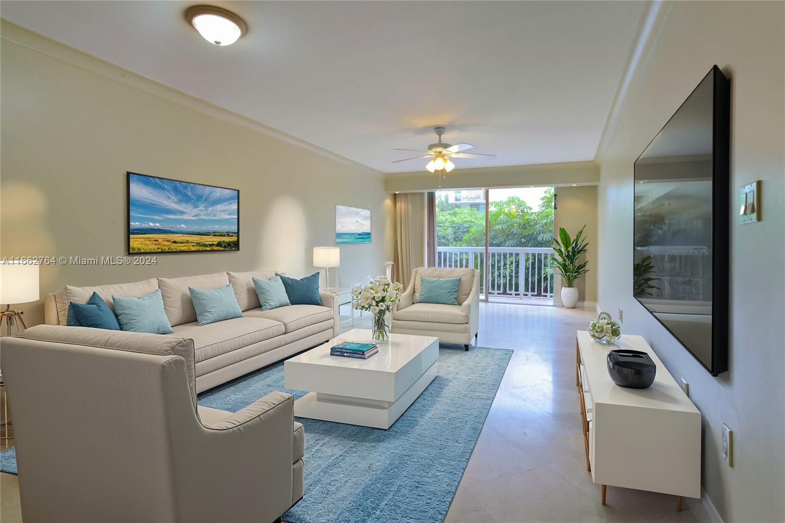 a living room with furniture and a floor to ceiling window