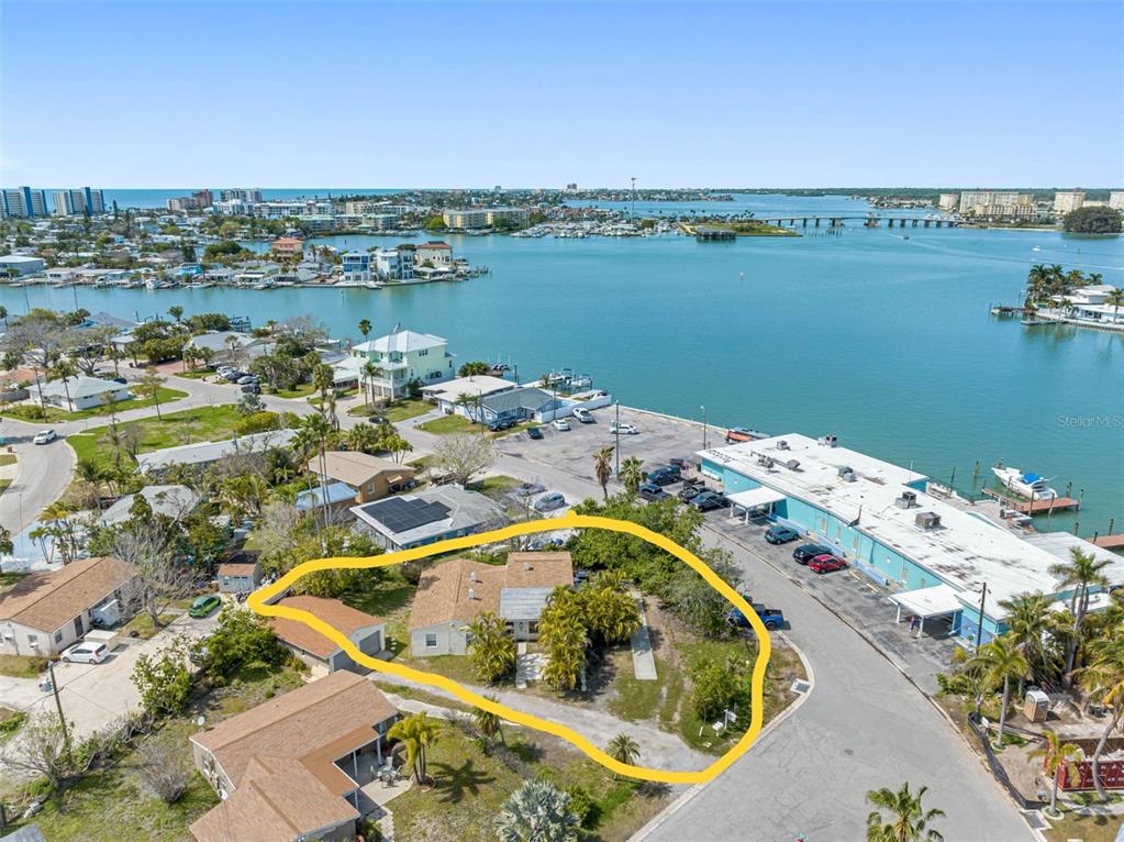 an aerial view of a house with a lake view