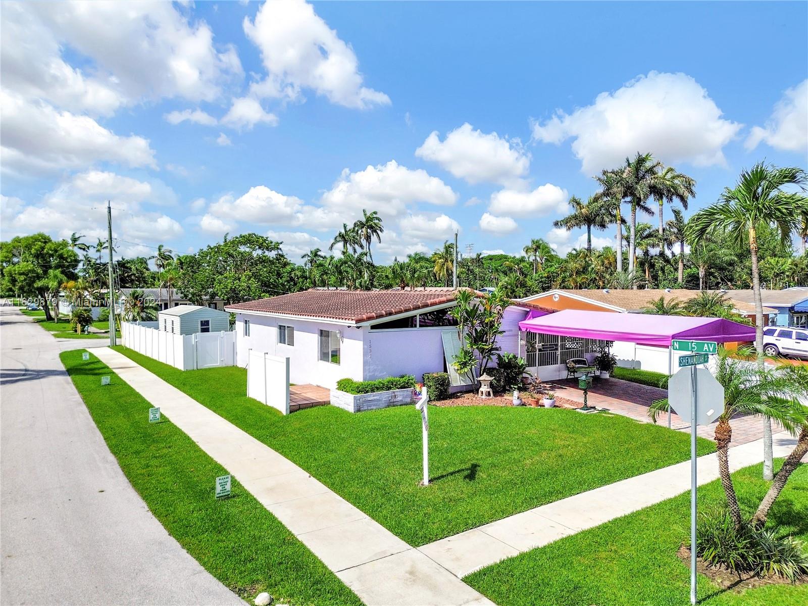 a view of a house with a big yard