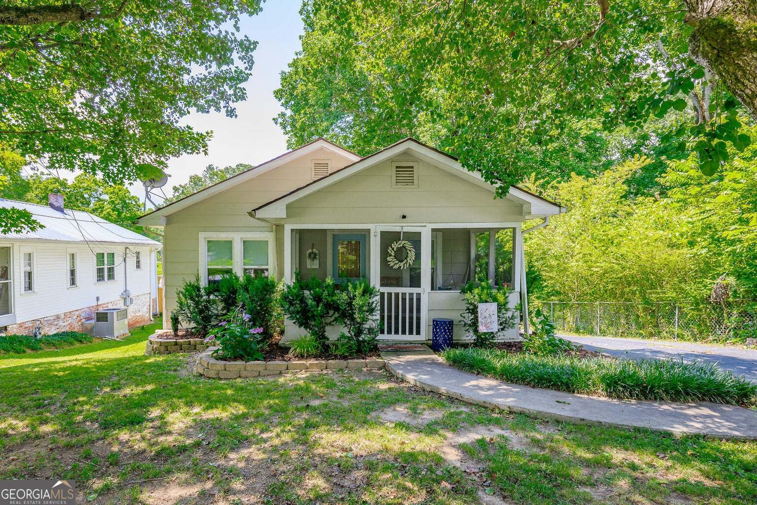 a front view of a house with a yard and porch