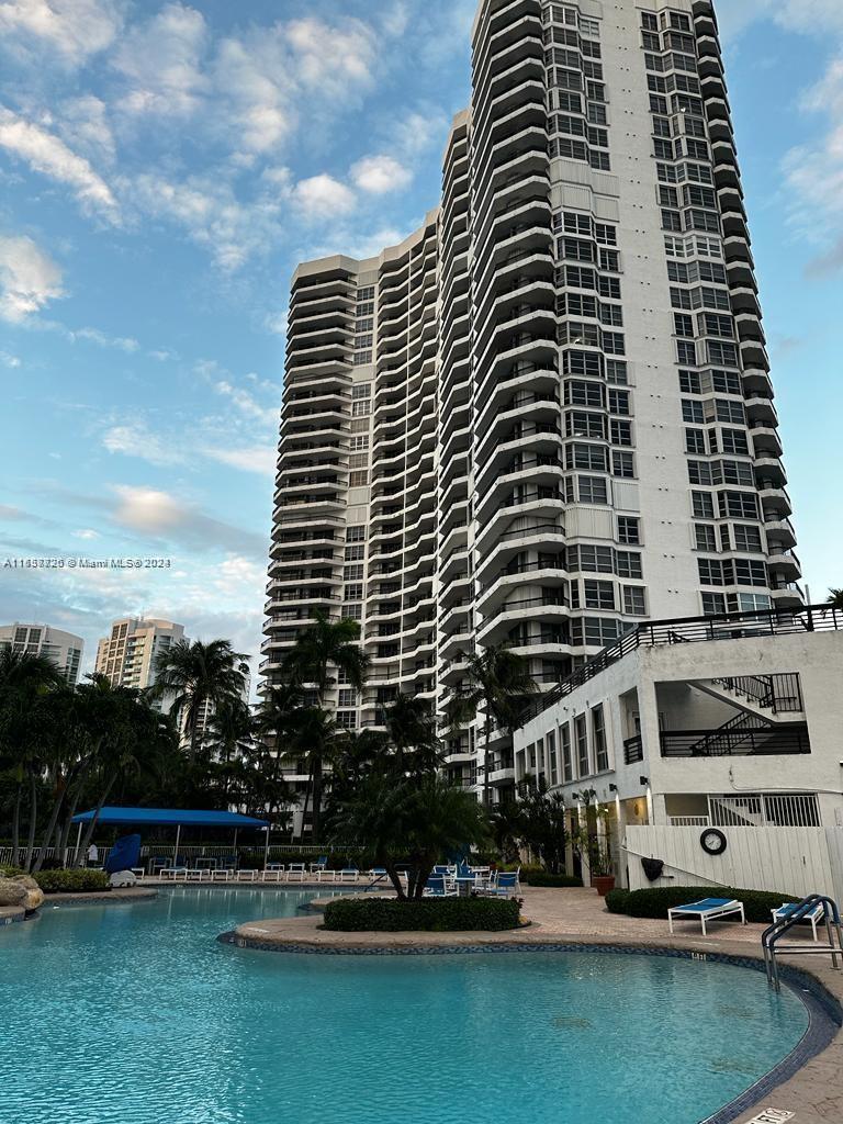 a front view of a building with lake view