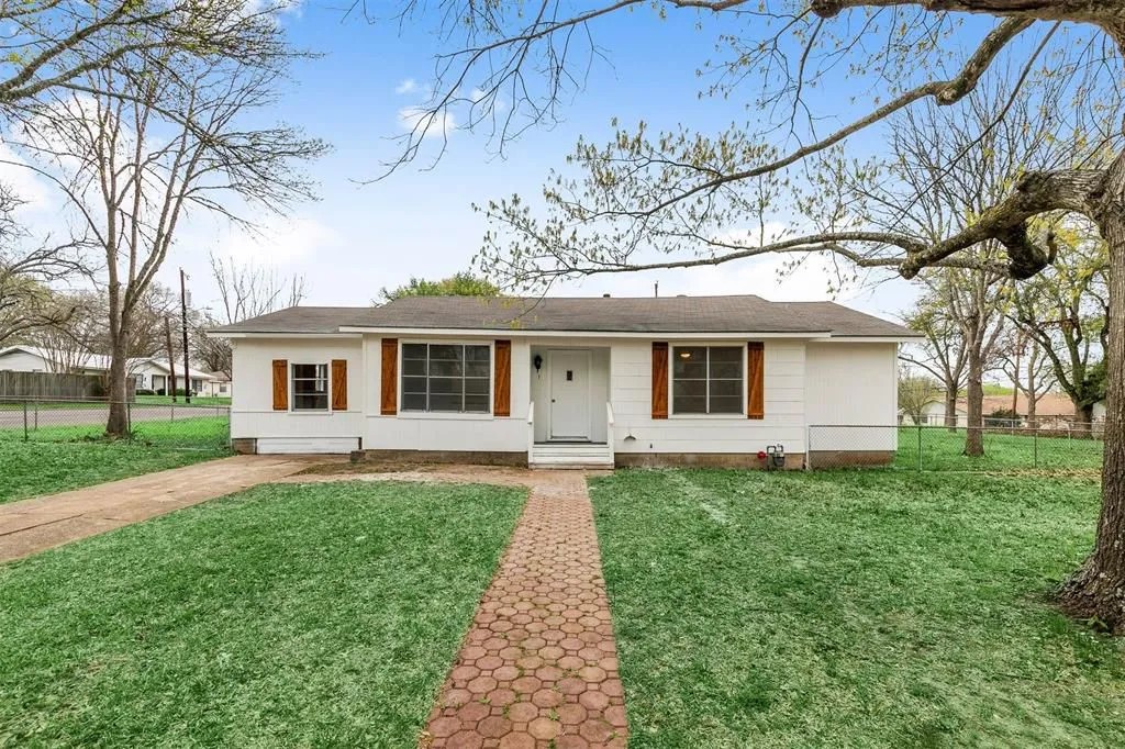 front view of a house with a yard