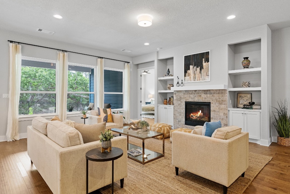 a living room with furniture and a fireplace