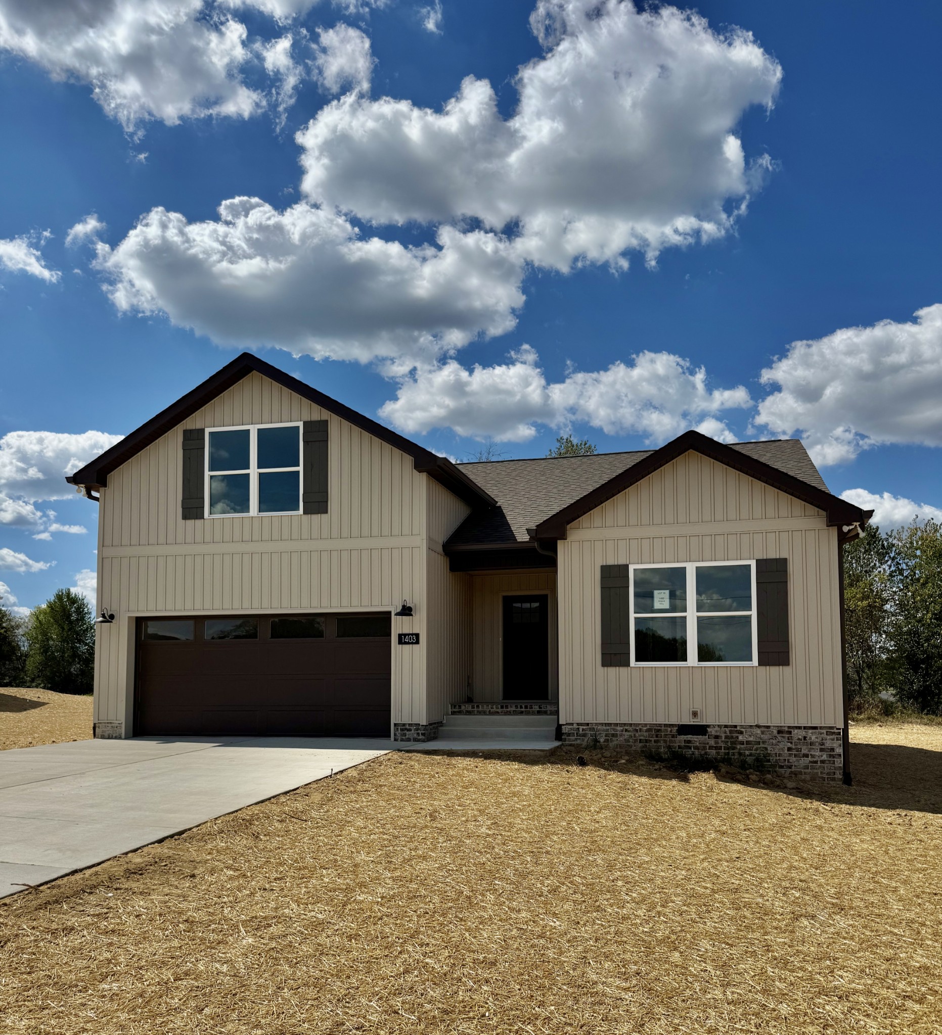 a front view of a house with a yard