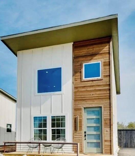 a front view of a house with glass windows