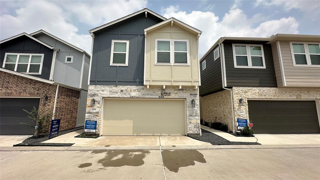 a front view of a house with a garage