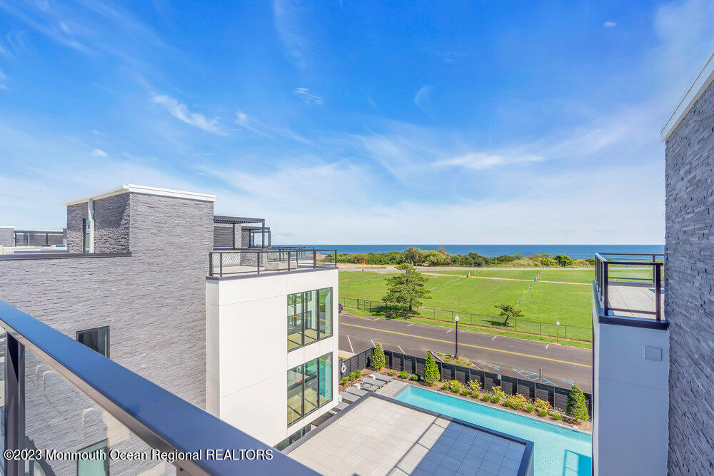 a view of a balcony with an ocean view