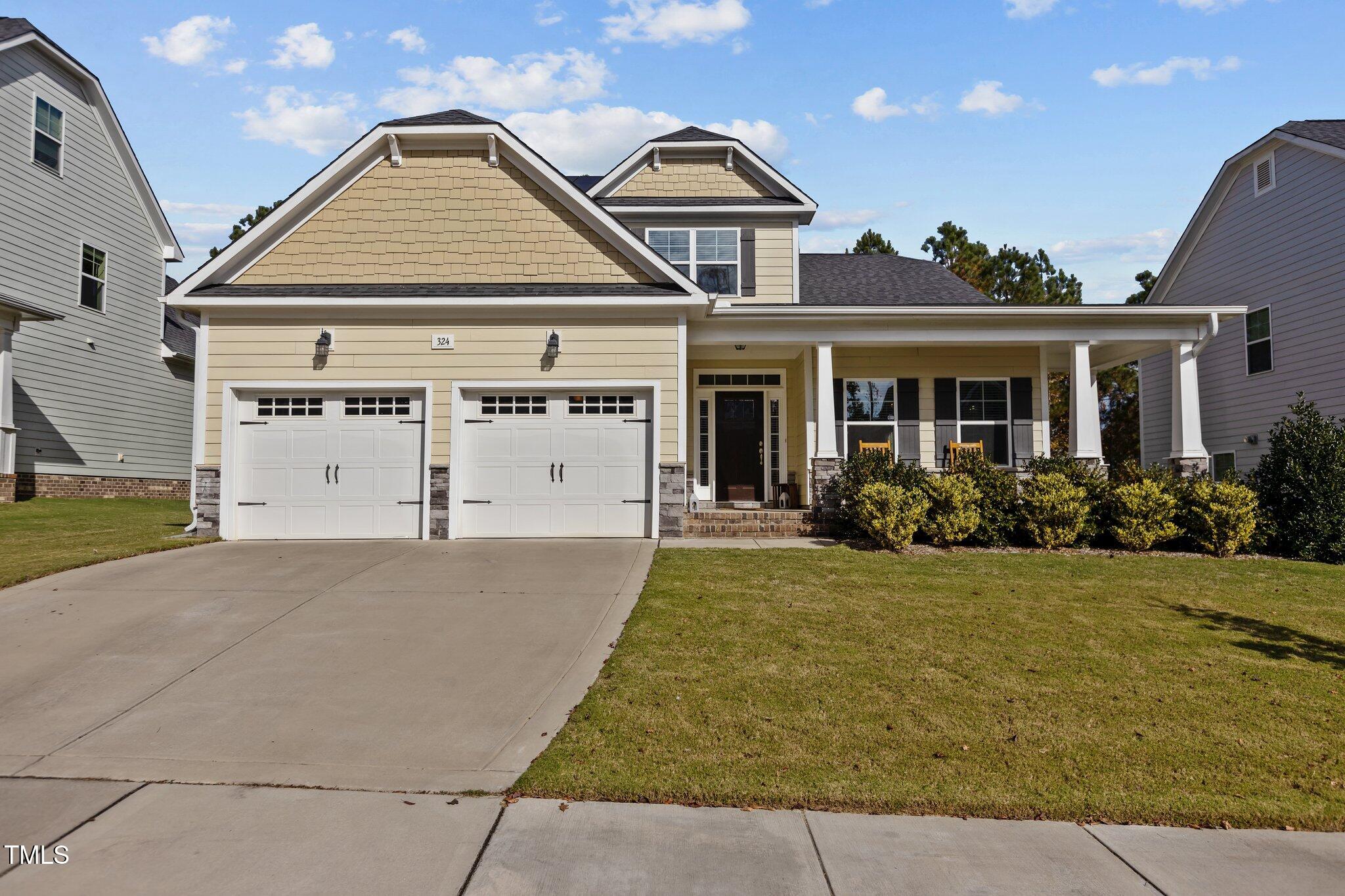 front view of a house with a yard