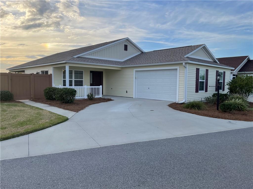 a front view of a house with garage