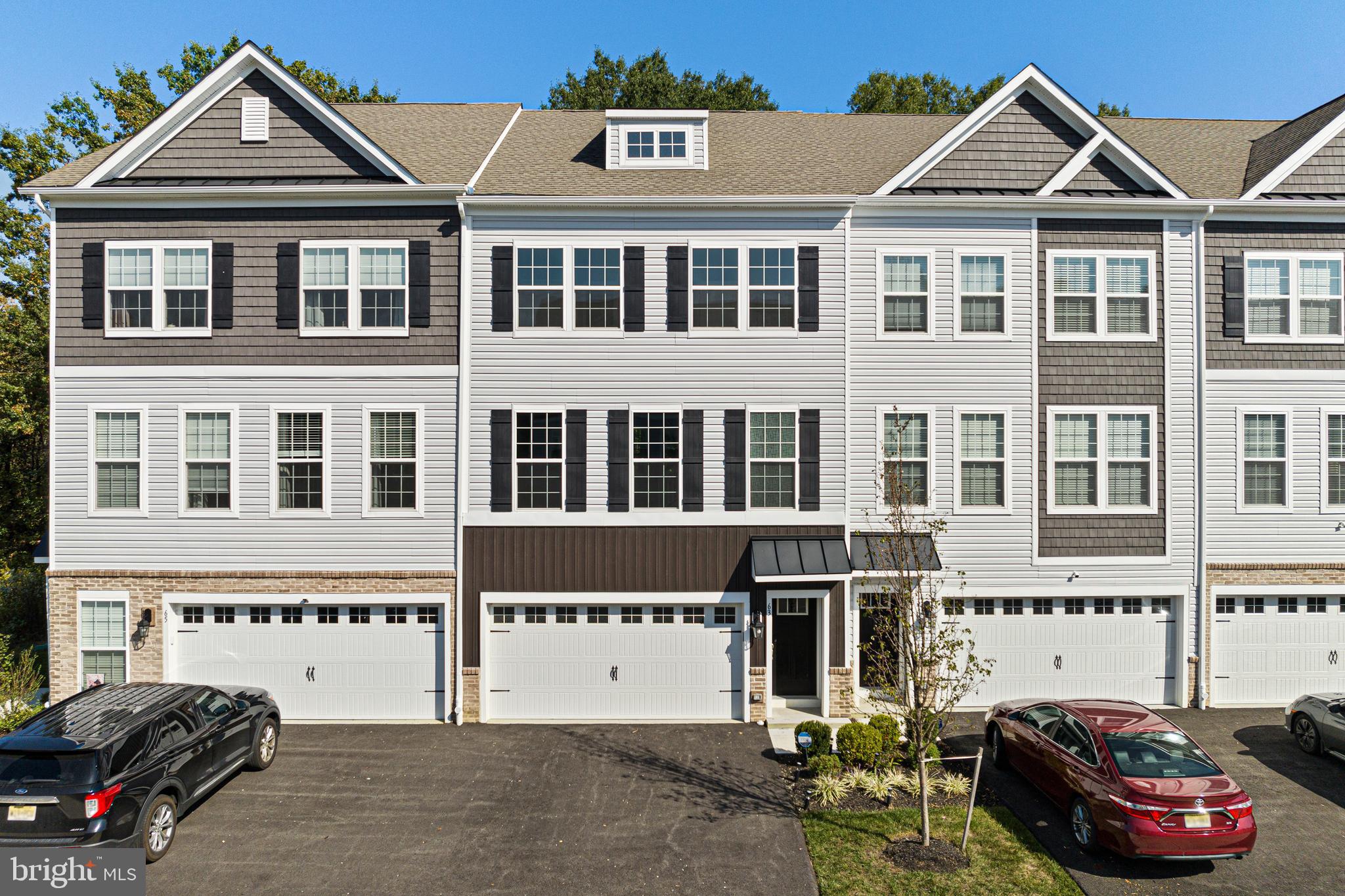 a front view of a house with parking space