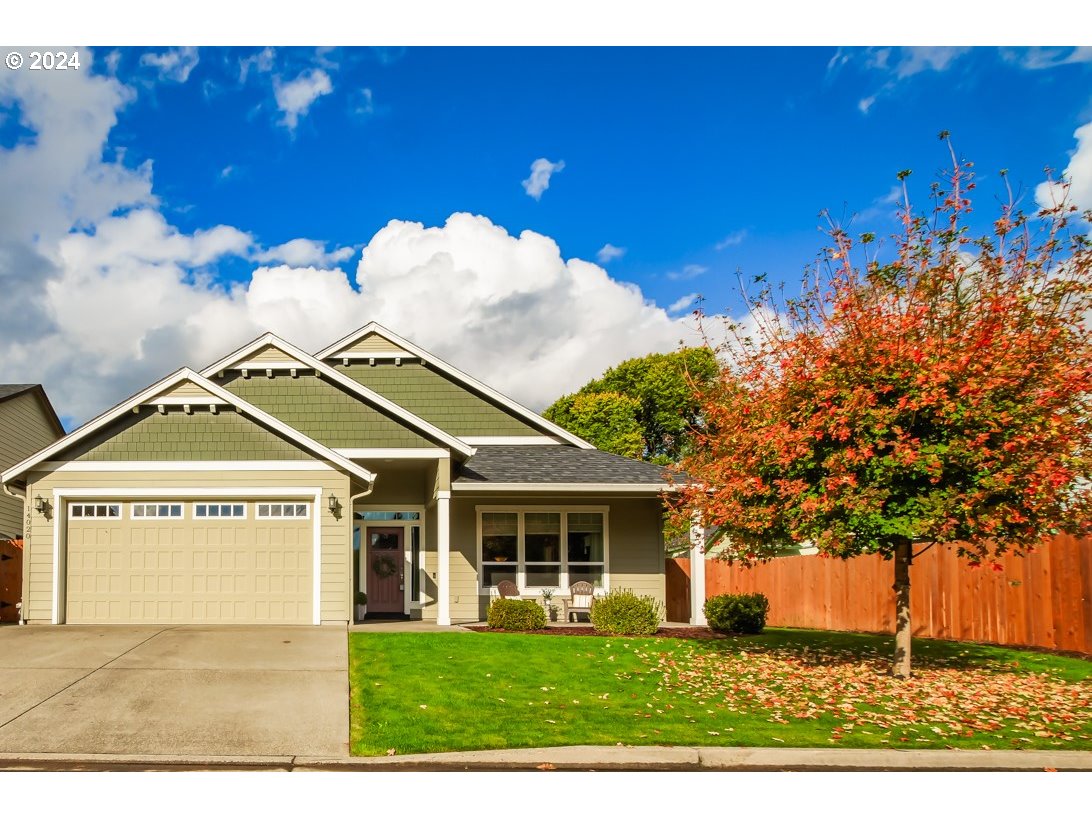 a view of a house with a yard