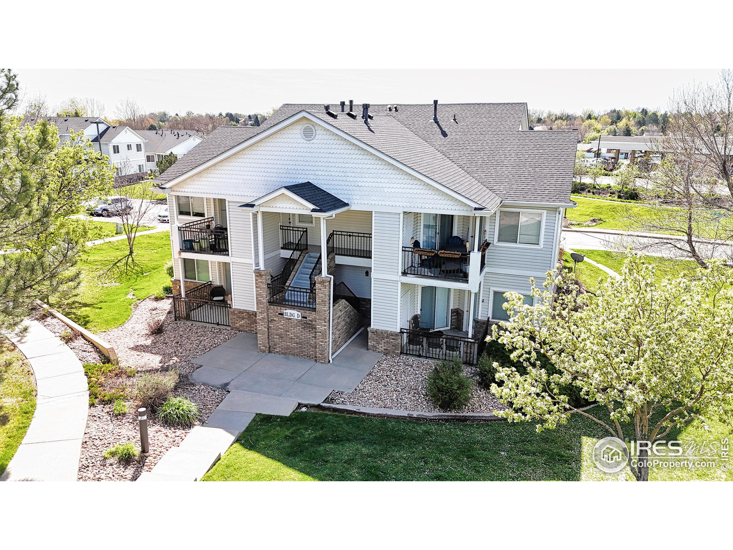 a view of a house with backyard porch and sitting area