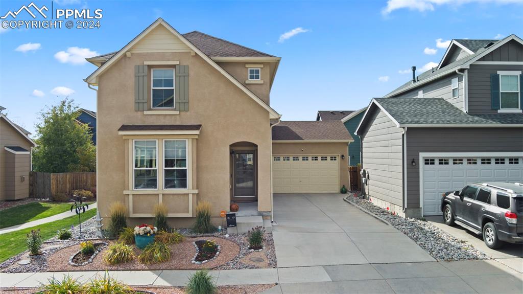 a front view of a house with a yard