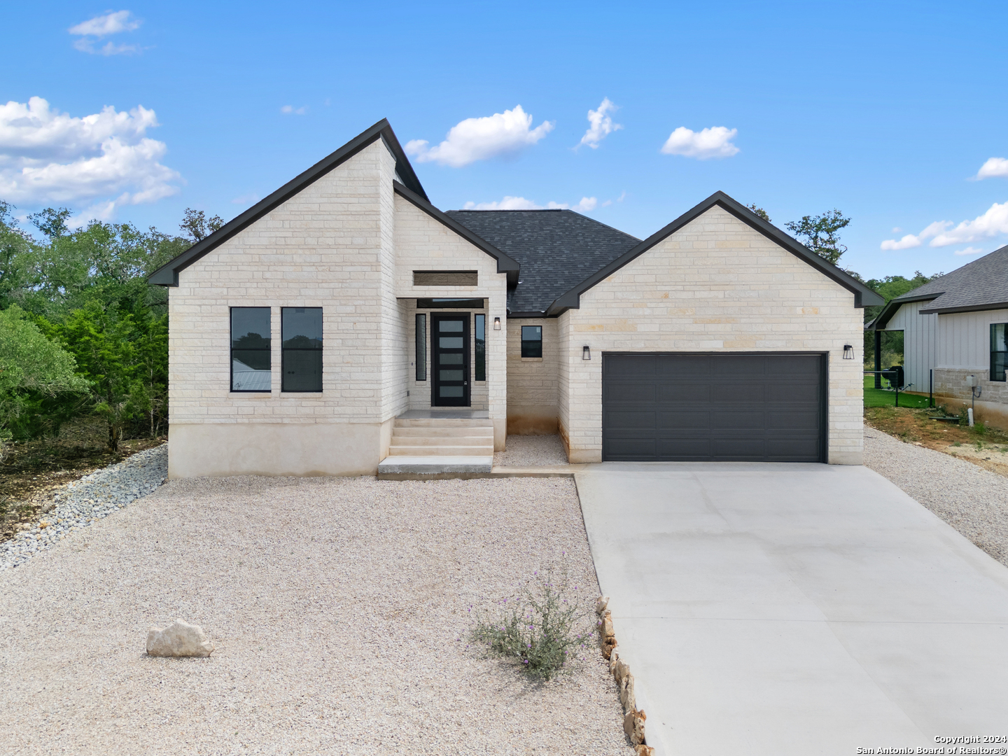 a front view of a house with a garage