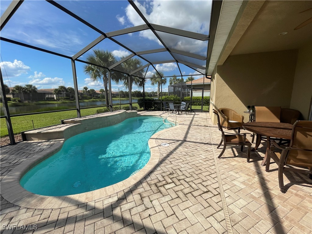 a view of a swimming pool with a patio