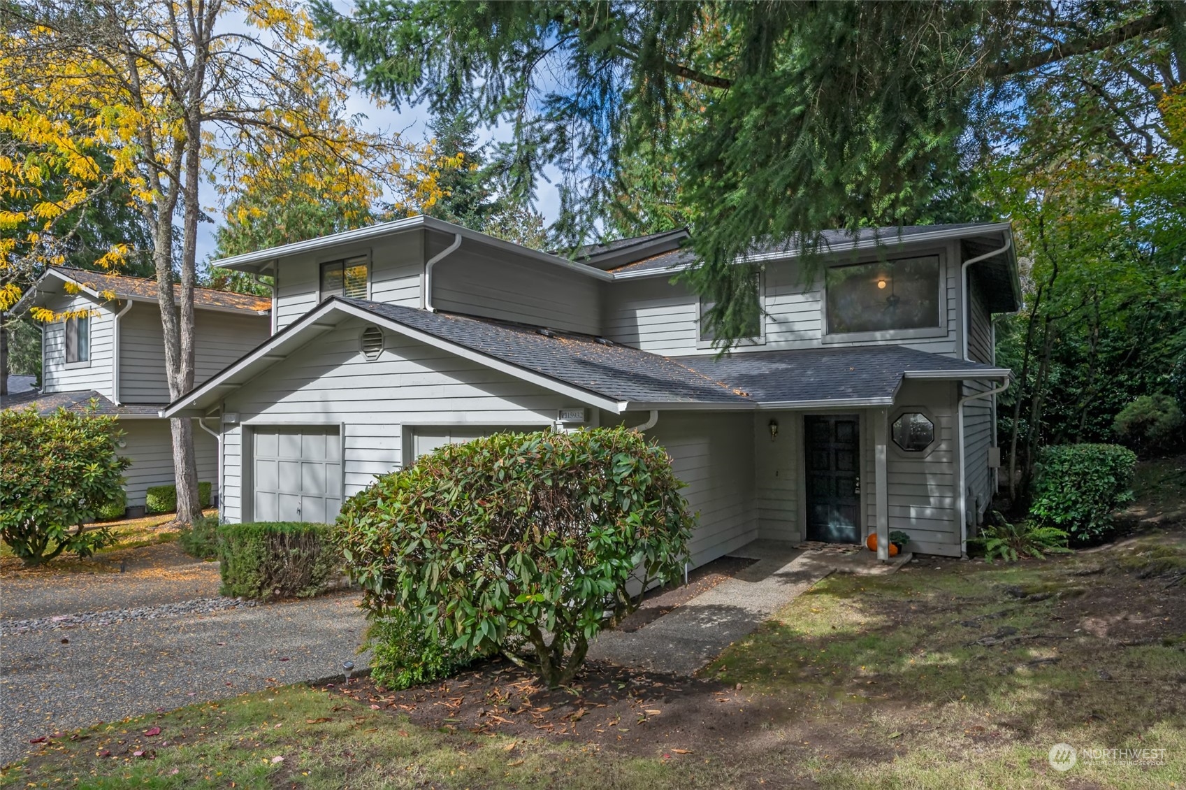 front view of a house with a tree