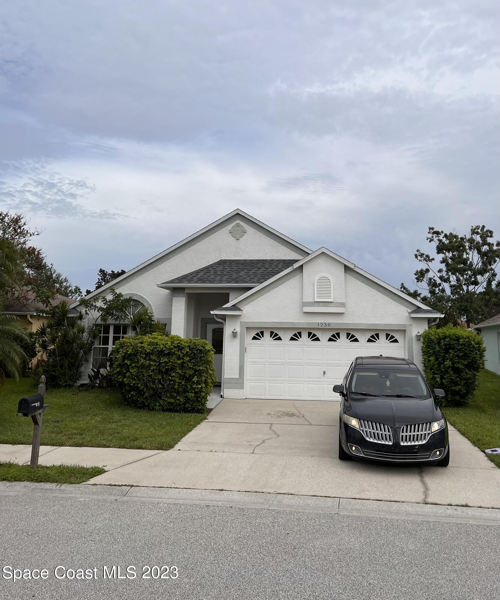 a car parked in front of a house