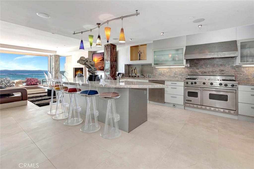 a kitchen with a stove a sink and a refrigerator