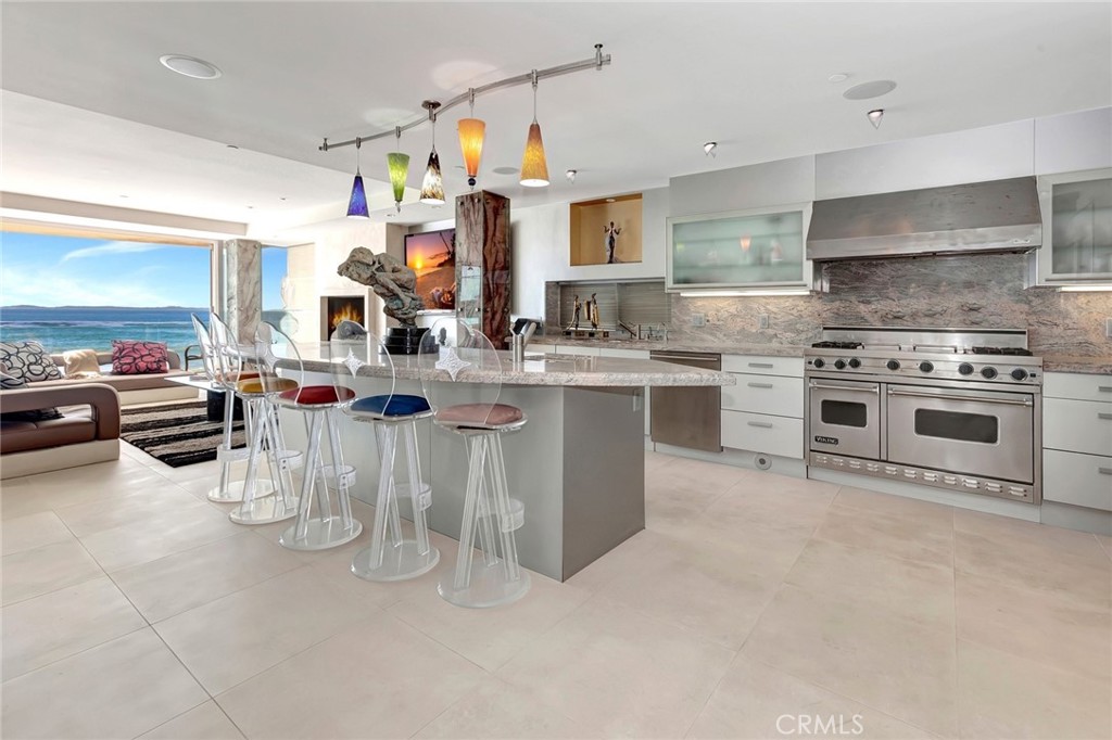 a kitchen with a stove a sink and a refrigerator