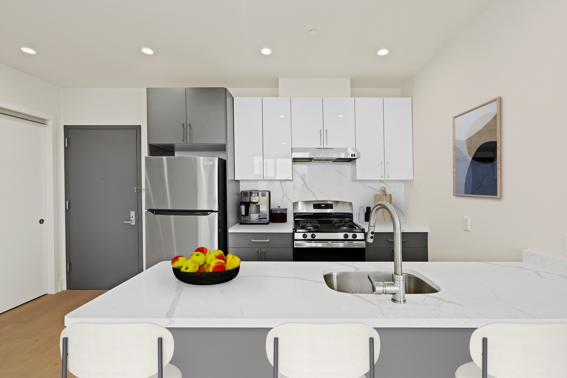 a kitchen with a sink a stove and refrigerator