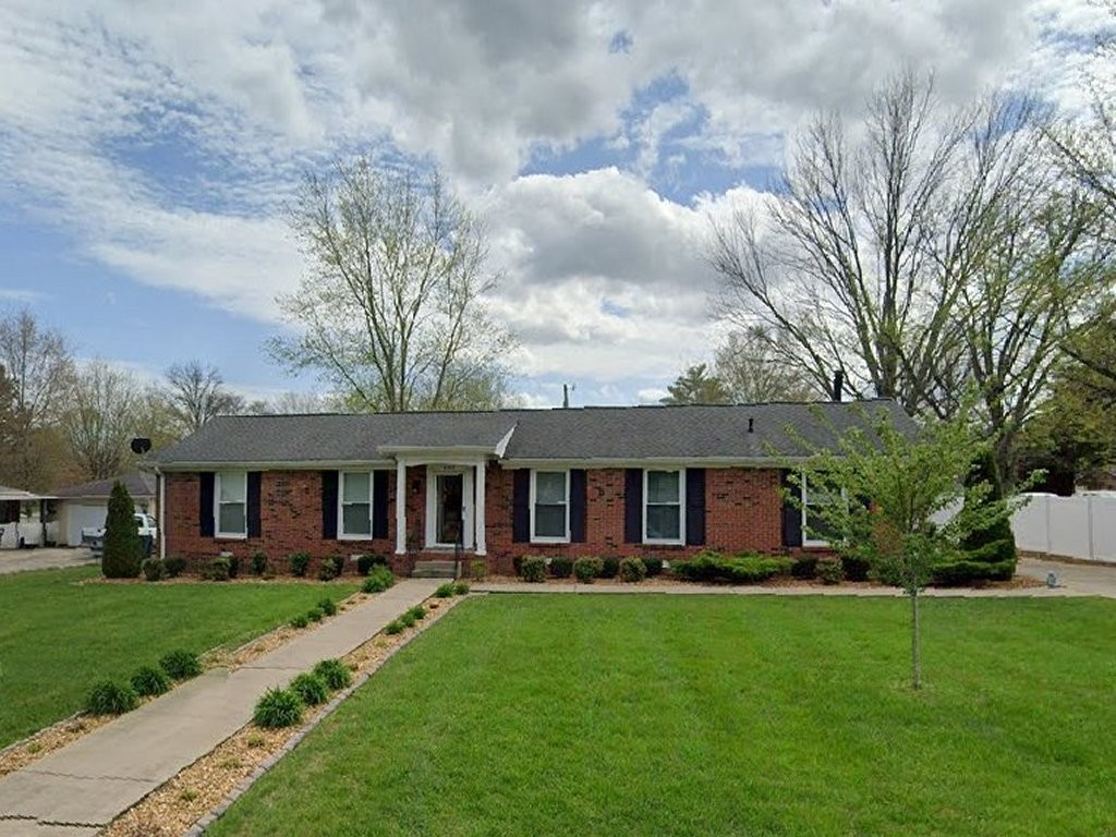 front view of a house with a yard