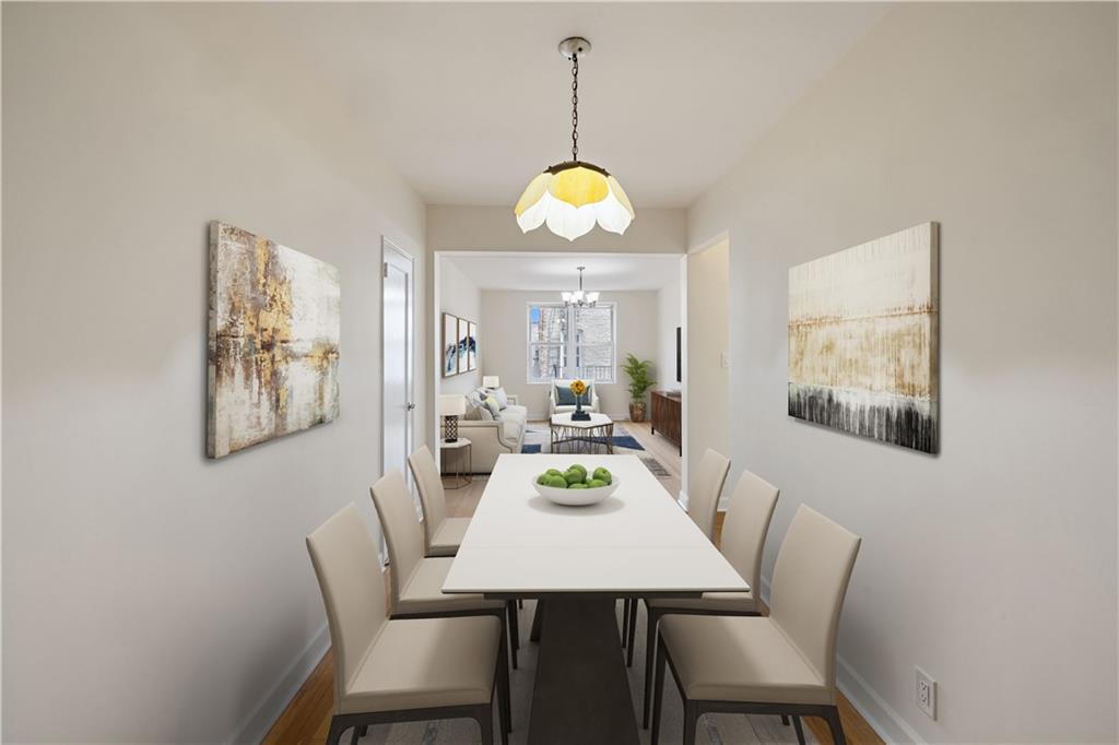 a view of a dining room with furniture wooden floor and a chandelier