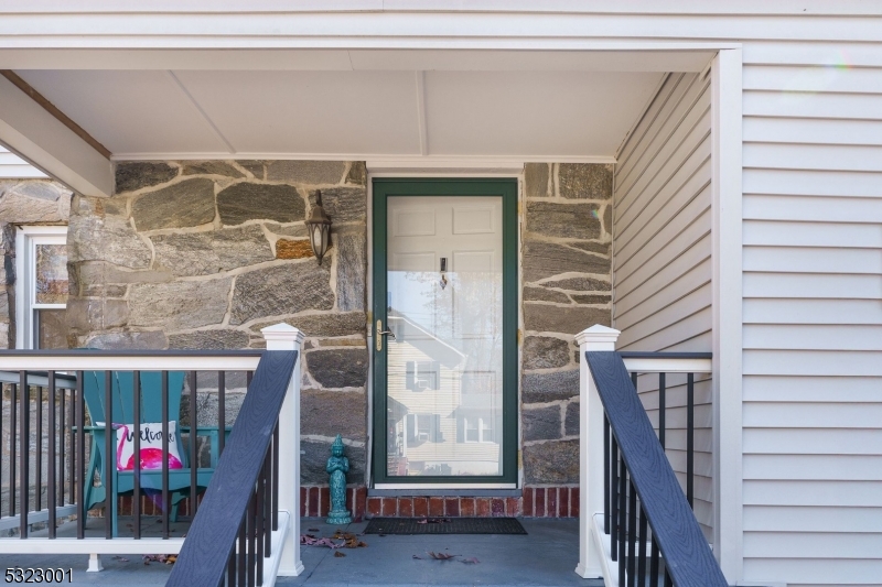 a view of entryway with a wooden door