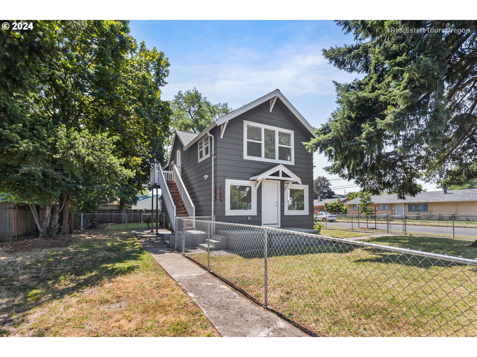 a front view of a house with a yard