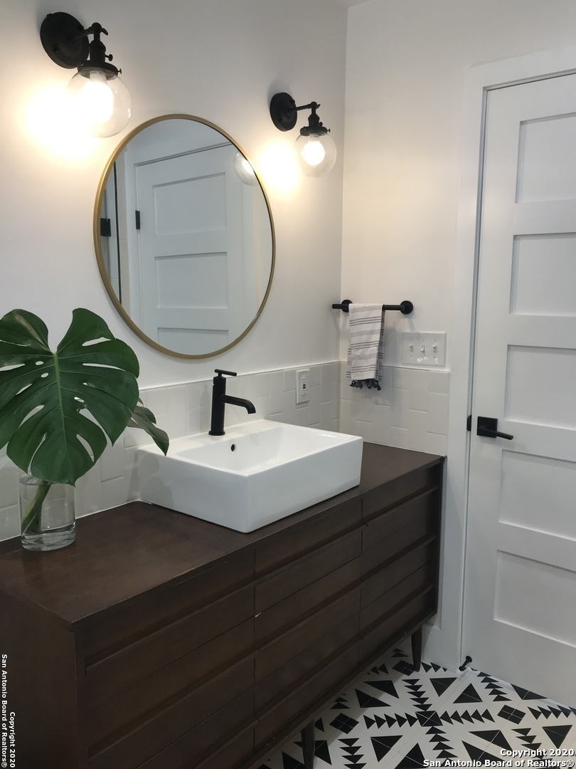 a bathroom with a sink and a mirror