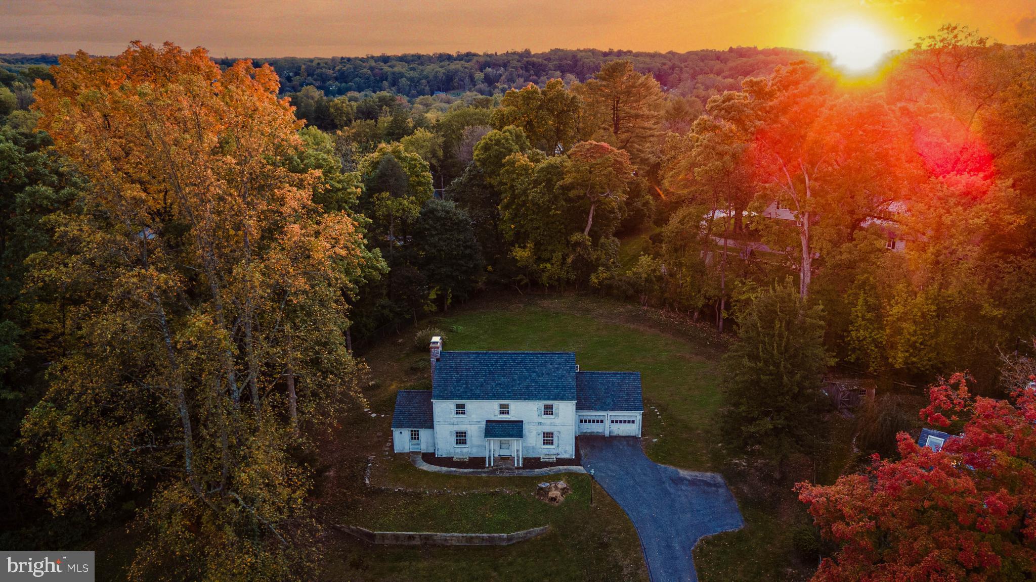 a aerial view of a house with a yard