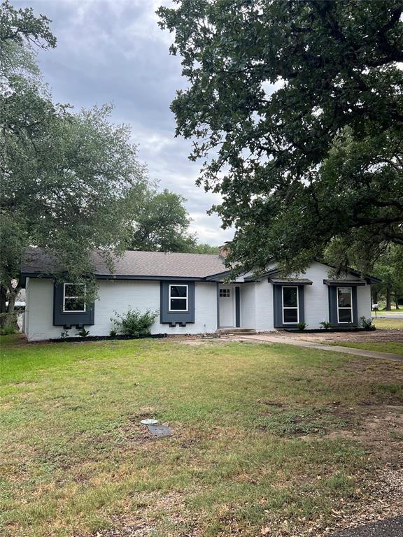 front view of a house with a yard