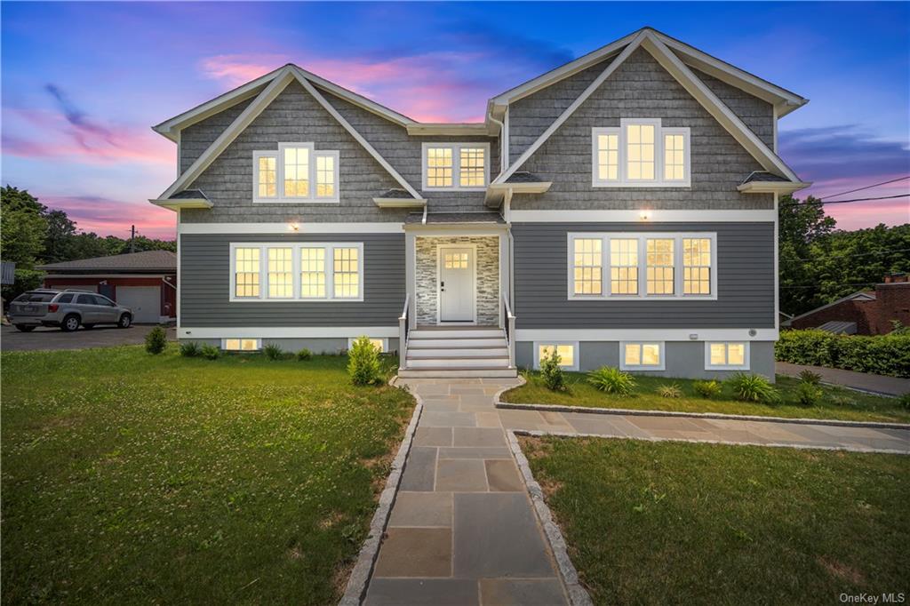 a front view of a house with a yard