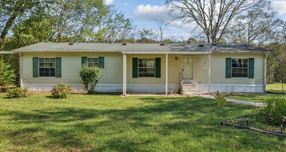 front view of a house with a yard